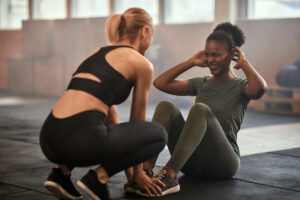 Two women working out in a gym
