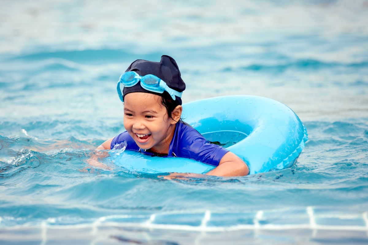 asian girl swimming in pool