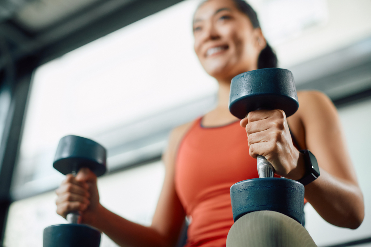 woman lifting weights in a gym